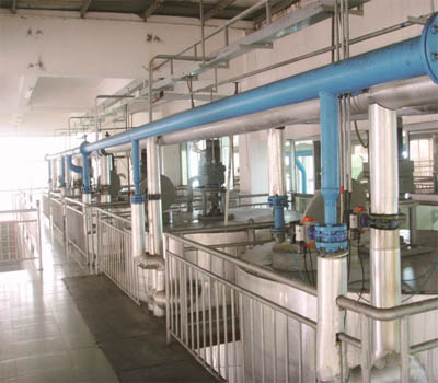 What is dewaxing in edible oil processing?